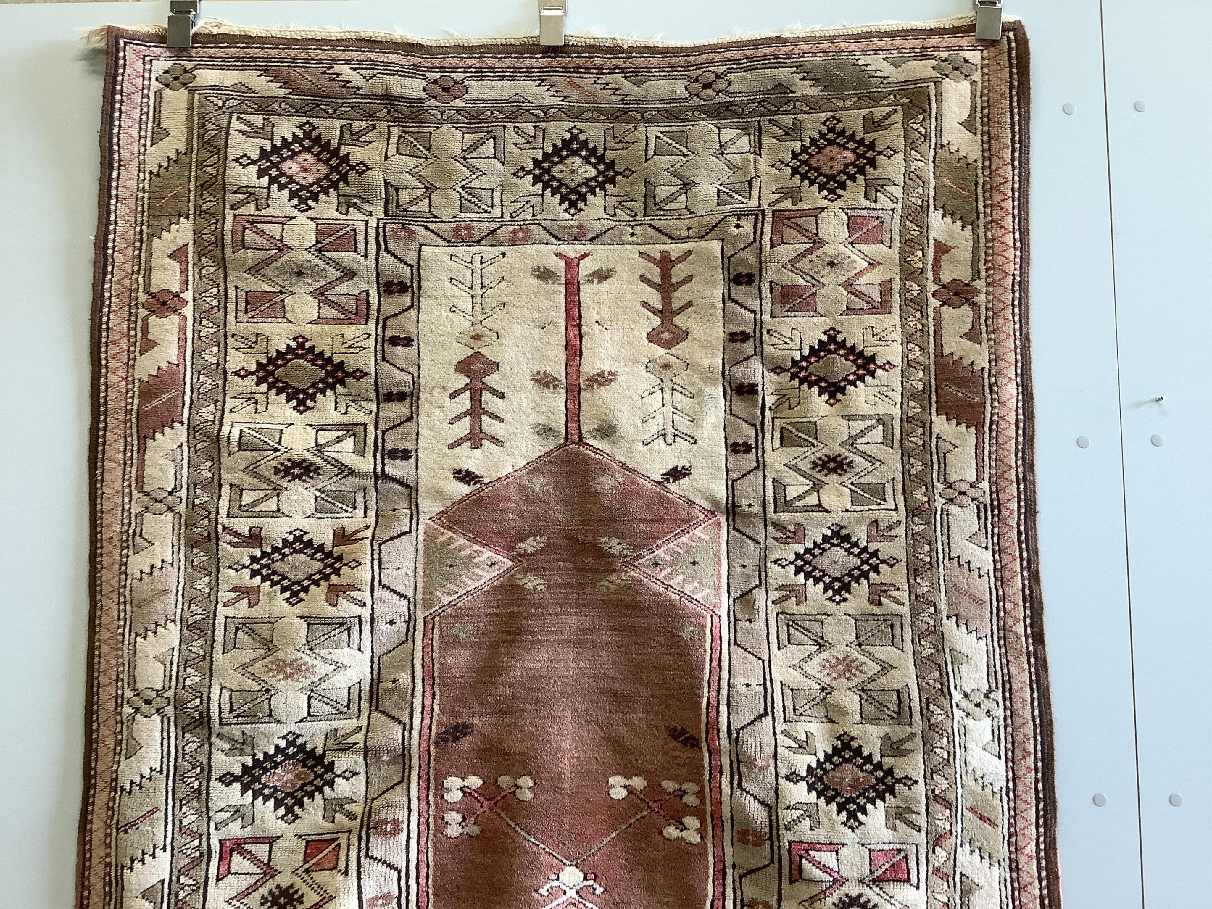 A Caucasian design red ground prayer rug, 193 x 124cm